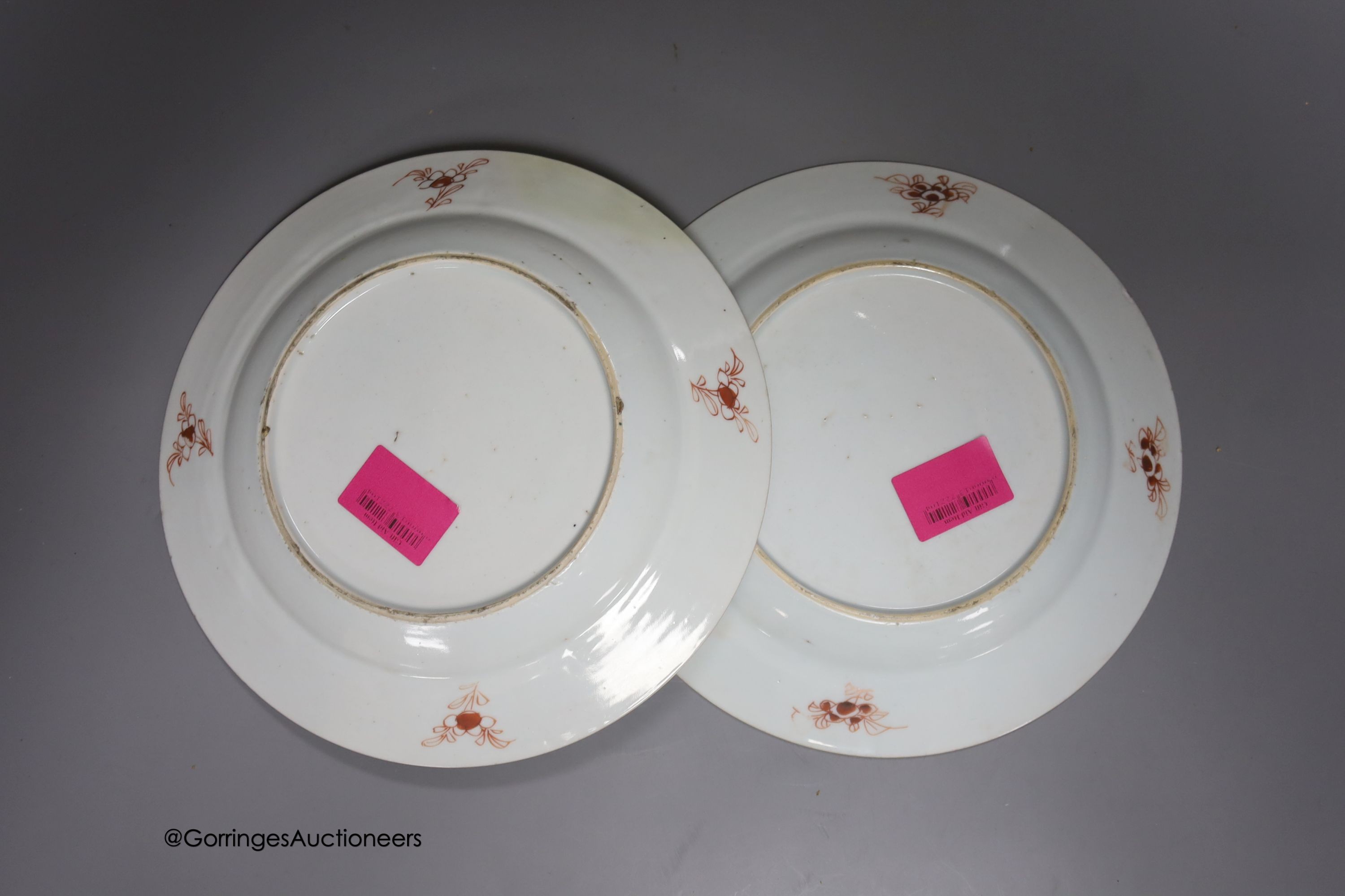 A 19th century Chinese famille rose bowl, two saucers and two 18th century Chinese famille rose plates 23cm